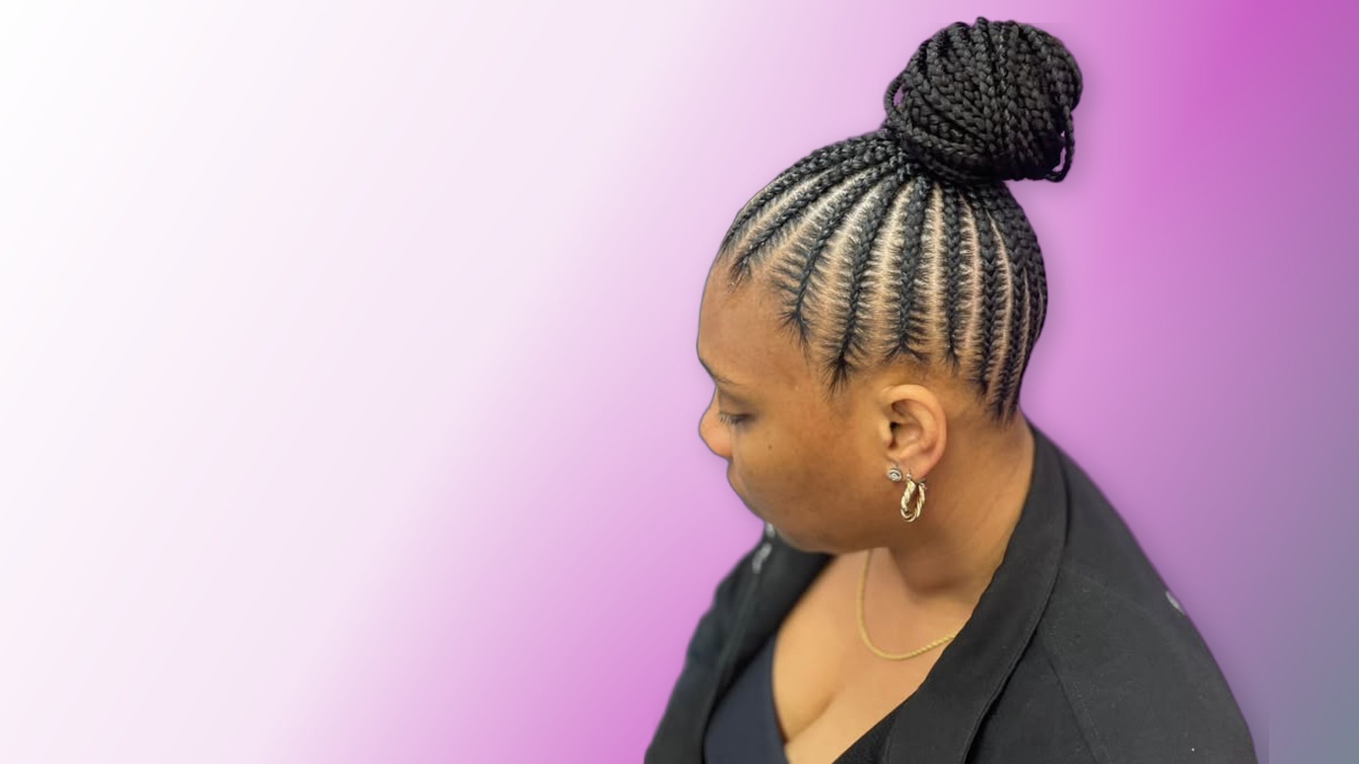 Stitch braids styled into a ponytail bun